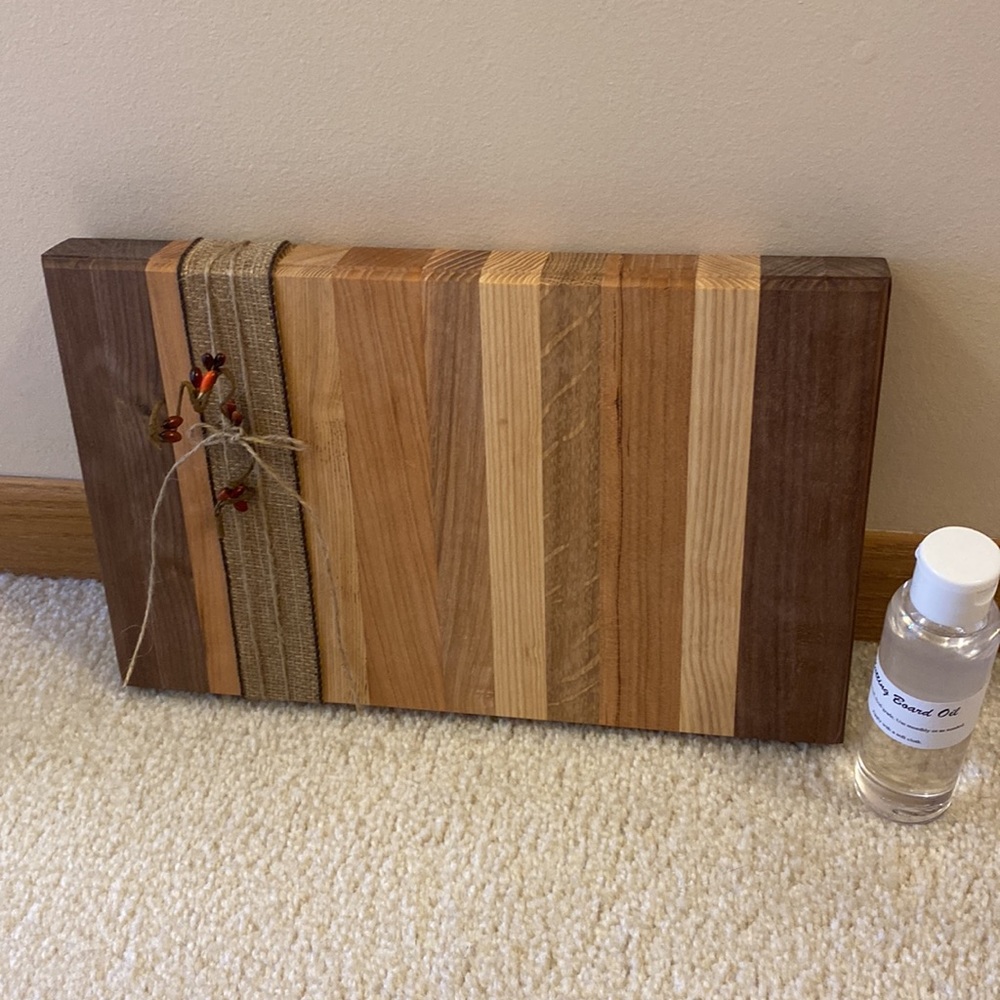 New multi wood board with board oil. Never used!